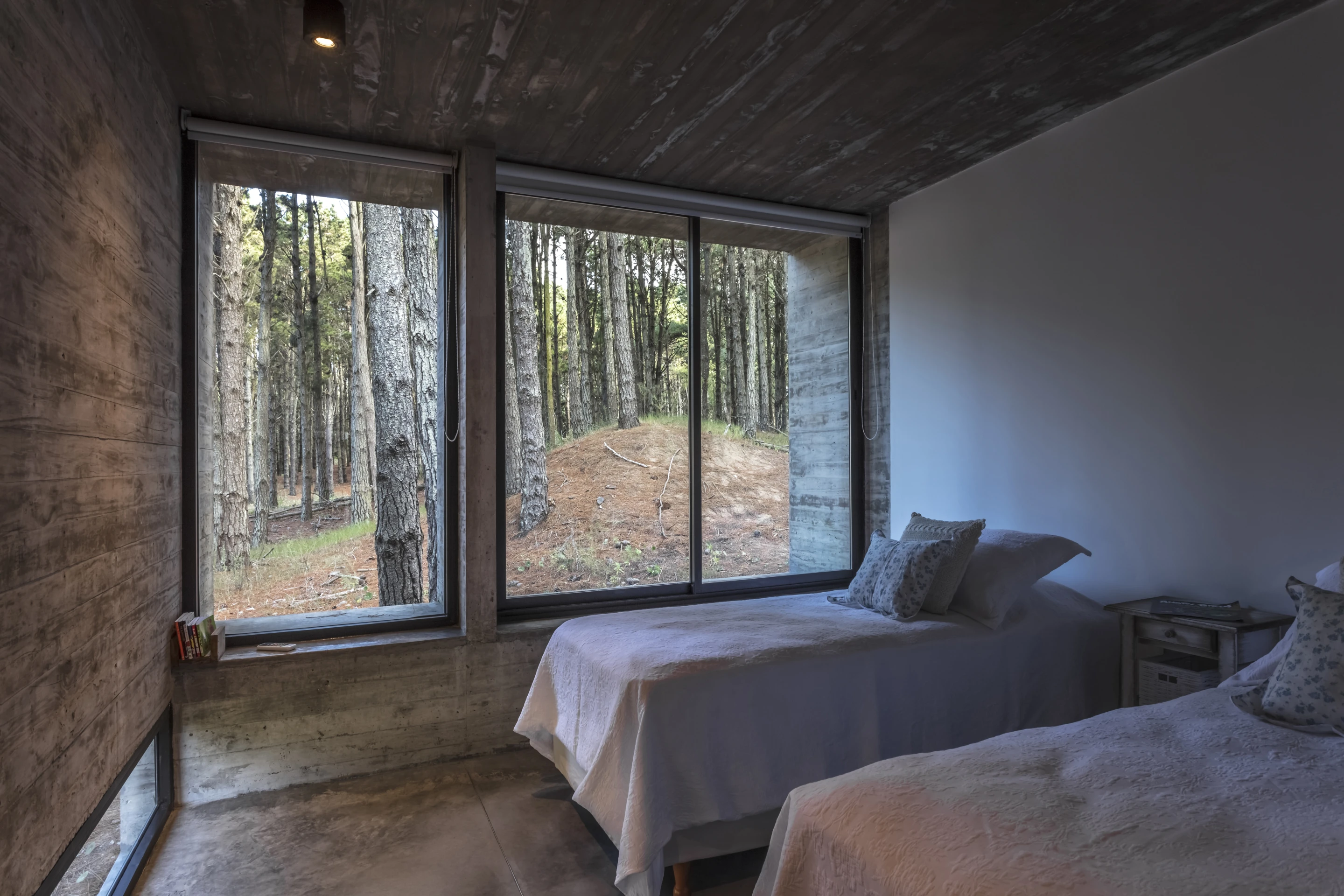 The bedrooms are situated at the upper end of the Forest House and lead down to the central living area on the middle level