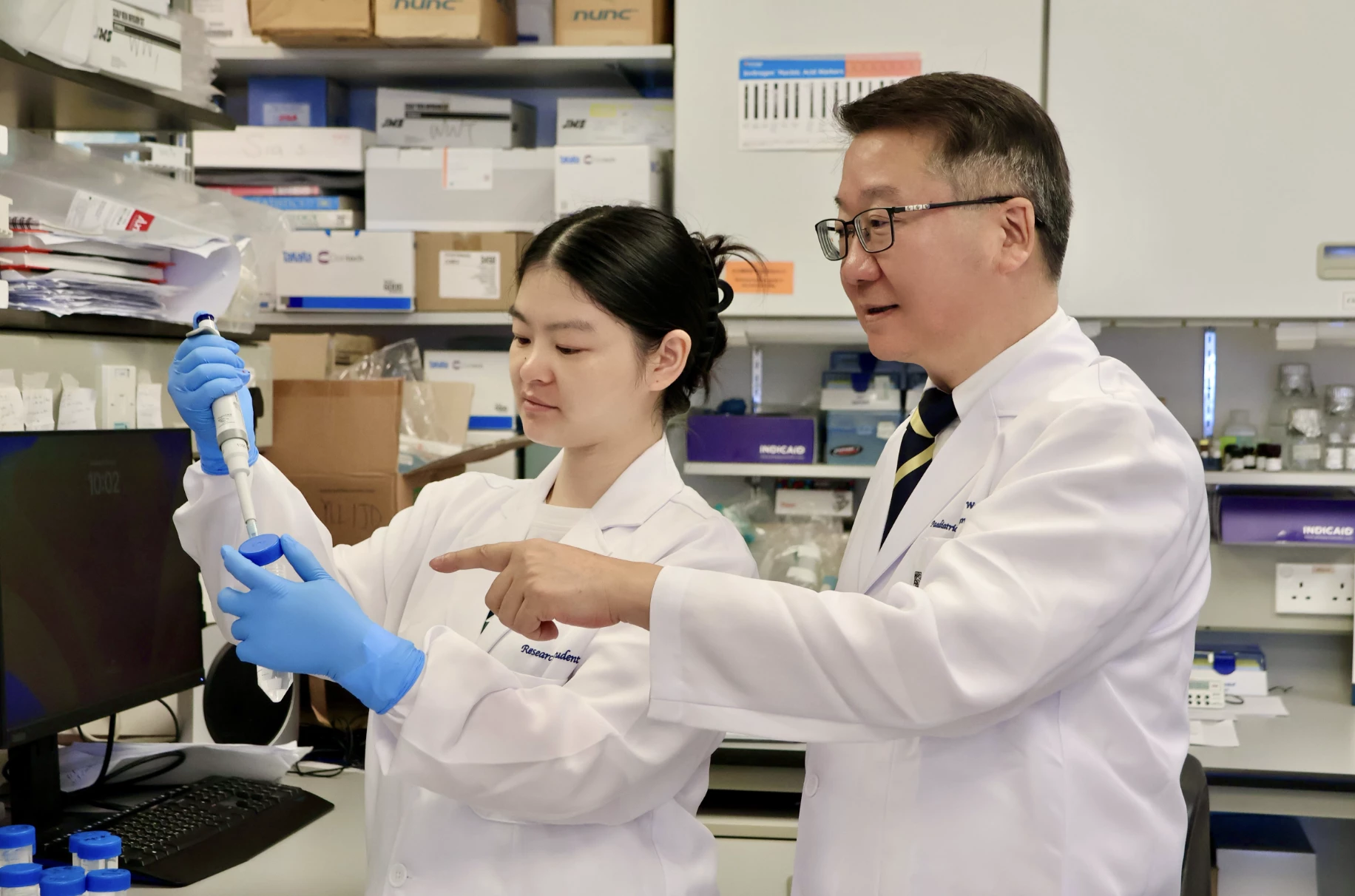 A research team, led by Professor Tu Wenwei (right), has discovered that certain dietary fatty acids can supercharge the human immune system's ability to fight cancer