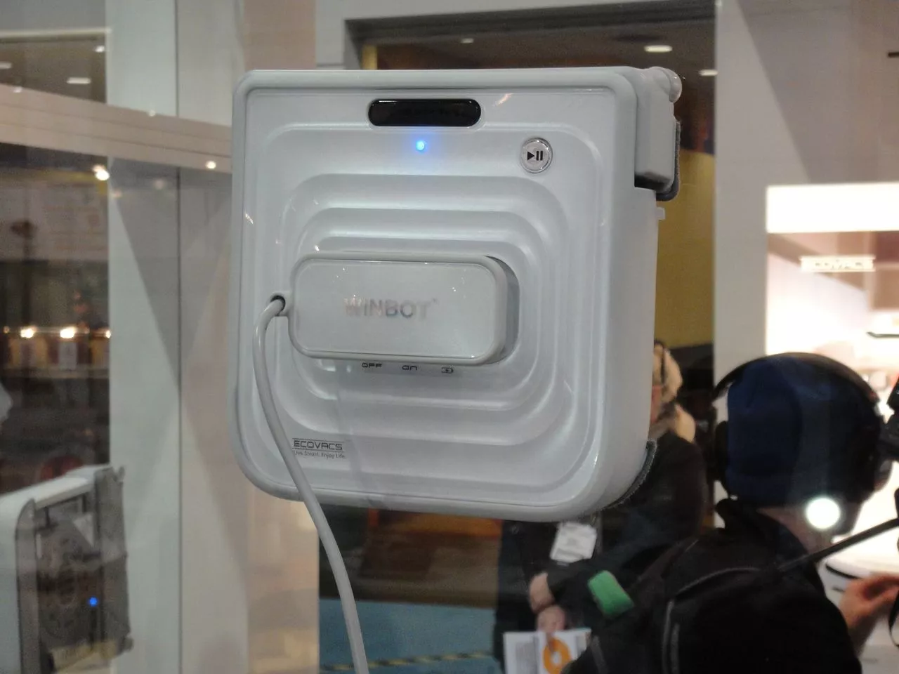 The Winbot 7 window cleaning robot adheres to a window using a pair of concentric suction rings