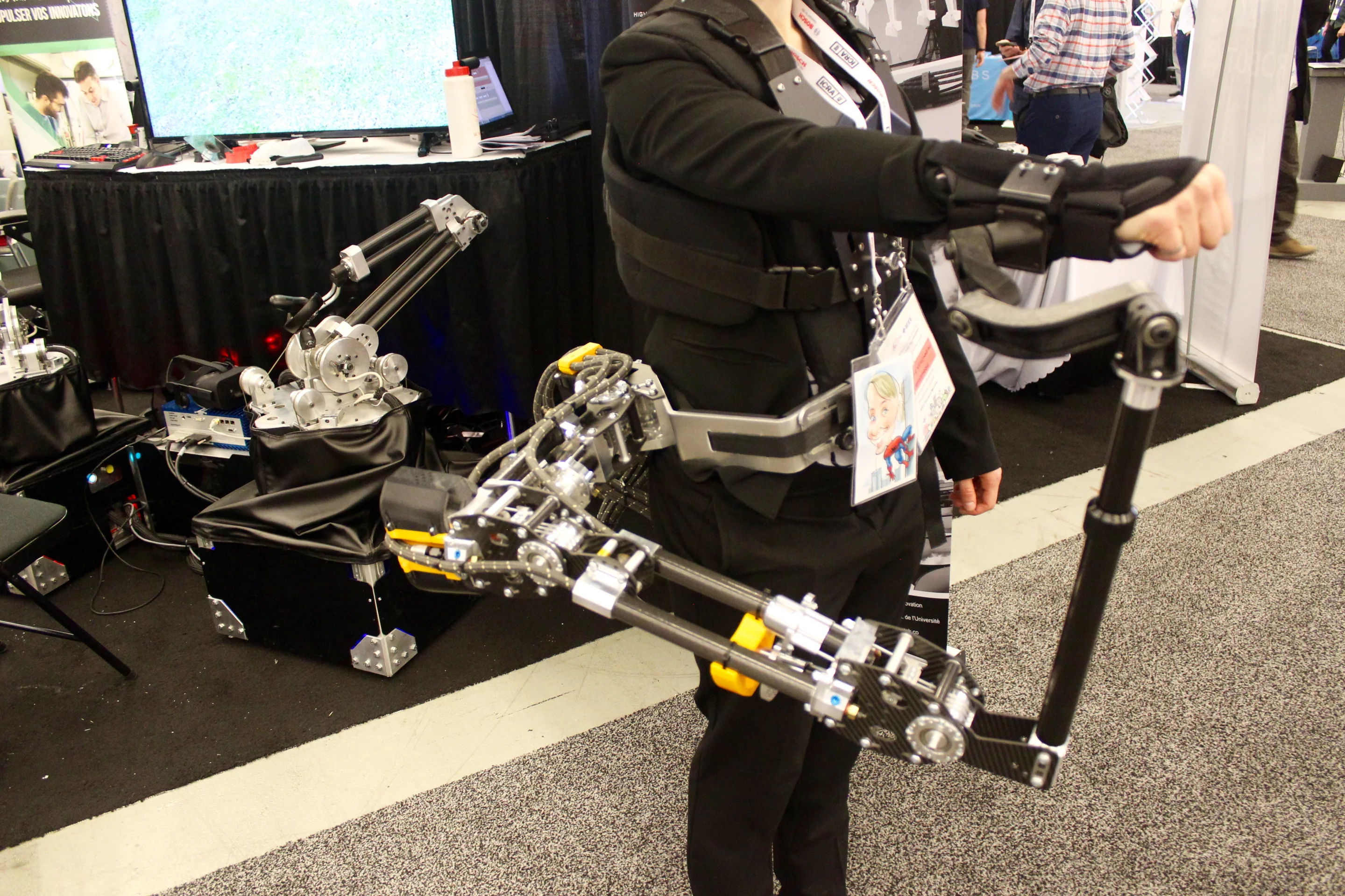 This third arm, developed at Sherbrooke University, can be used either as a robotic body-mounted grasping arm, or as an exoskeleton-type support for the wearer's own arm
