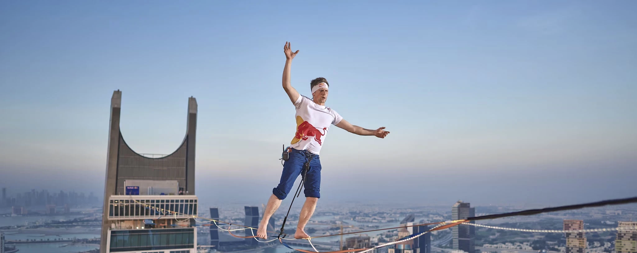 Jaan Roose slacklines the Katara Towers in Qatar's Lusail City