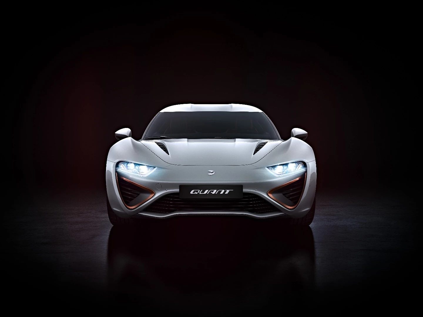 The face feels more production ready, the swirling intakes of the past replaced by a more simple slatted design