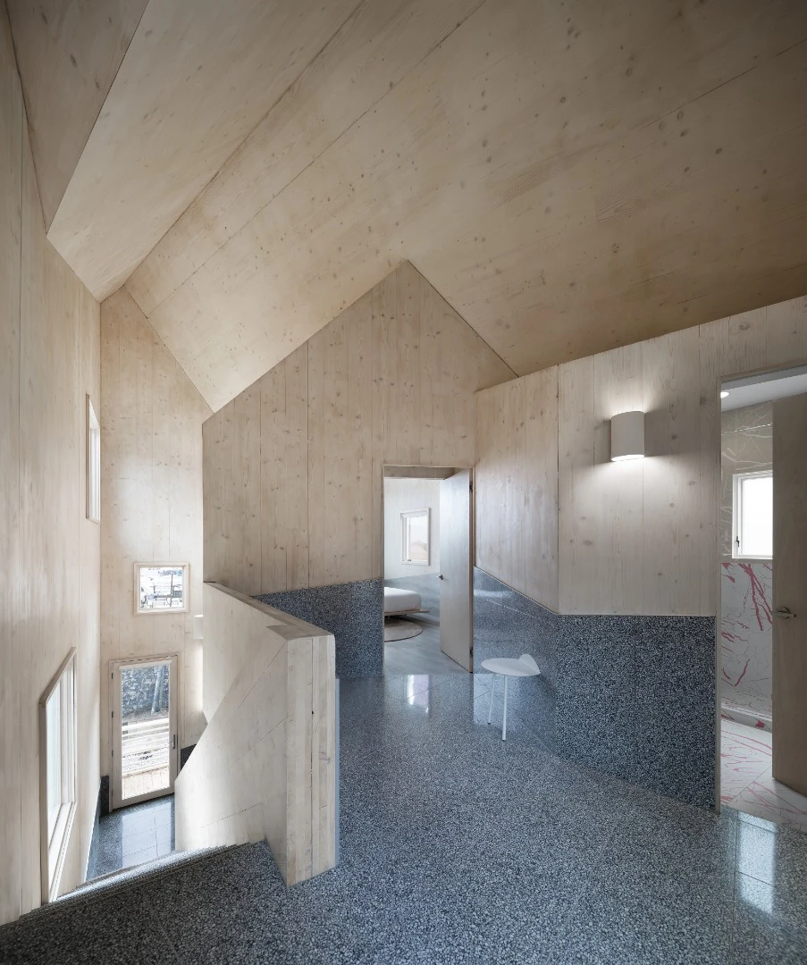 The unique roofline of Haus Gables is used to structure and organize the home’s interior space and layout