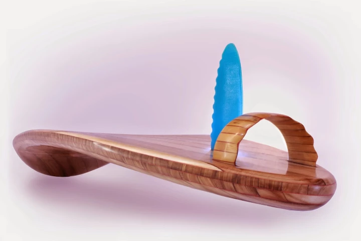 The Rampant borrows design elements from two of Roy Stuart's other wooden surfboards