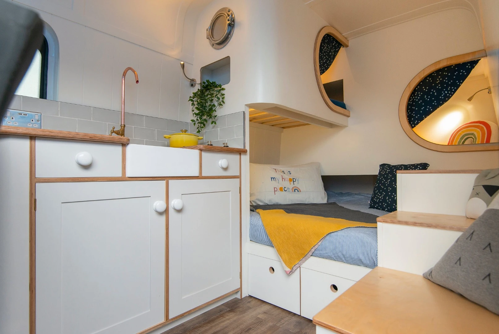 The heart of the motor home features bespoke mini kitchen and sleeping quarters