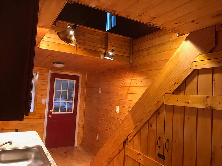 The Devasa's upstairs is reached by storage-integrated staircase