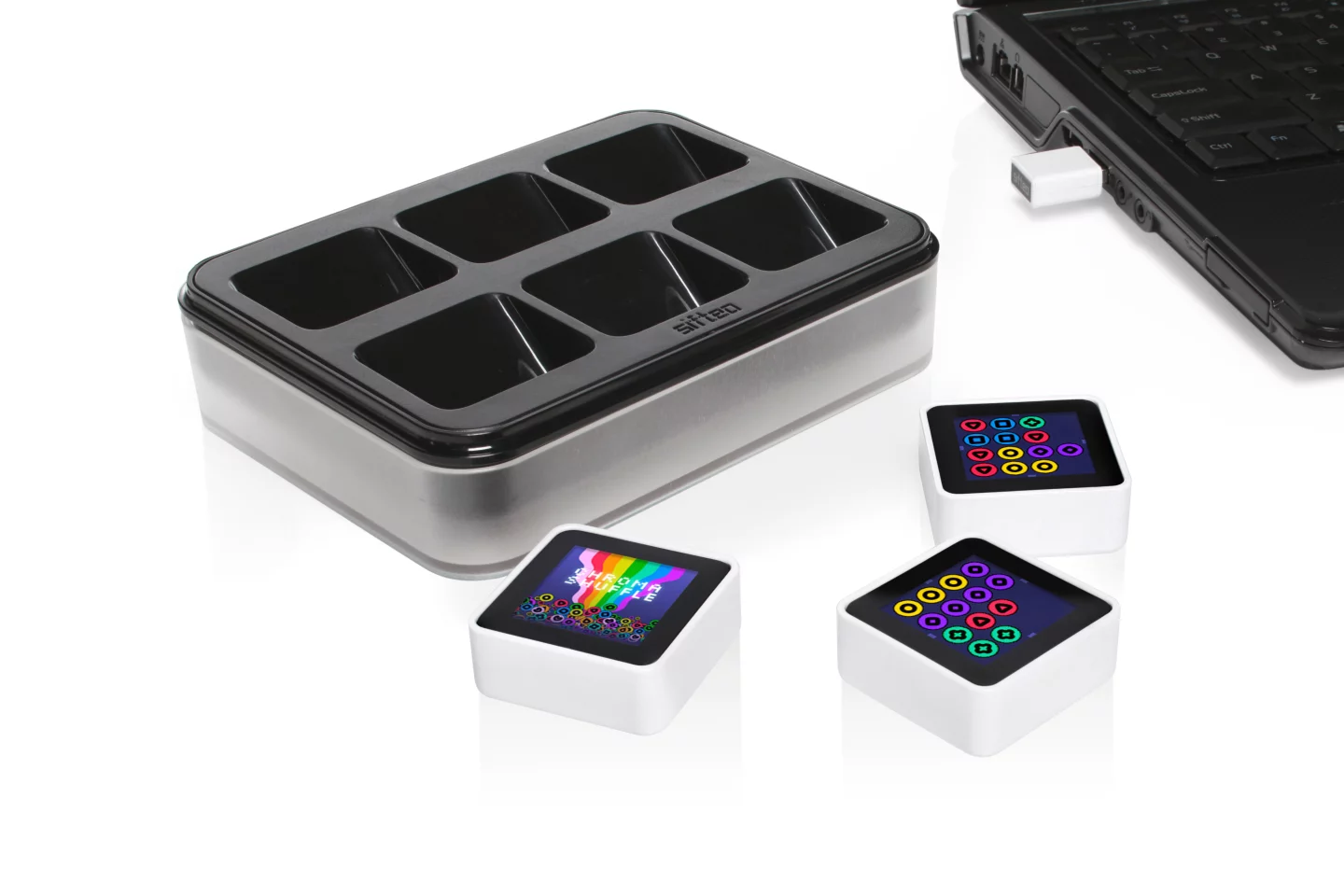 Each Sifteo Pack will contain three cubes, a charging hub sporting places for six cubes, and a USB radio link