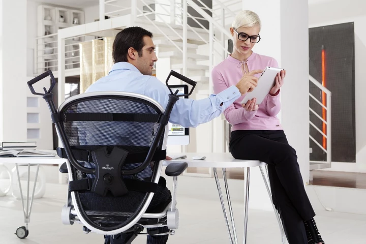 OfficeGym attaches to your chair to be used at any and every opportunity without interfering with your work