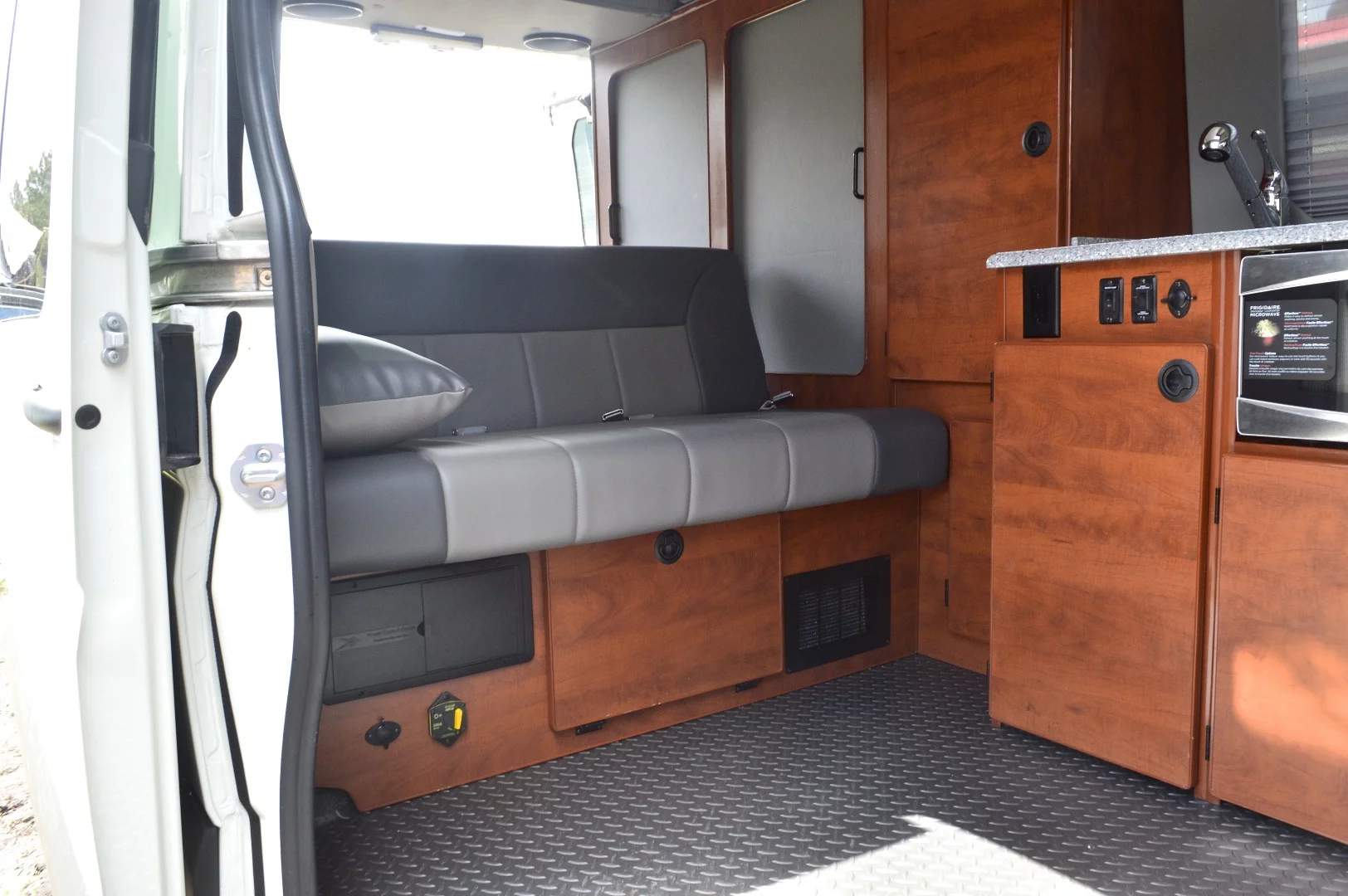 Inside, the Sportsmobile at Overland Expo has a full kitchen area and plenty of storage space
