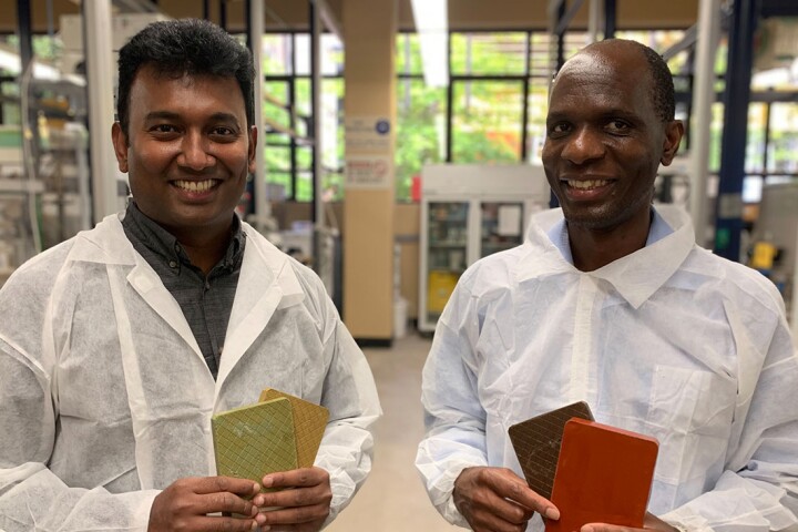 Assoc. Prof. Dilan Robert (left) and Assoc. Prof. Everson Kandare, with samples of the recycled-glass cladding