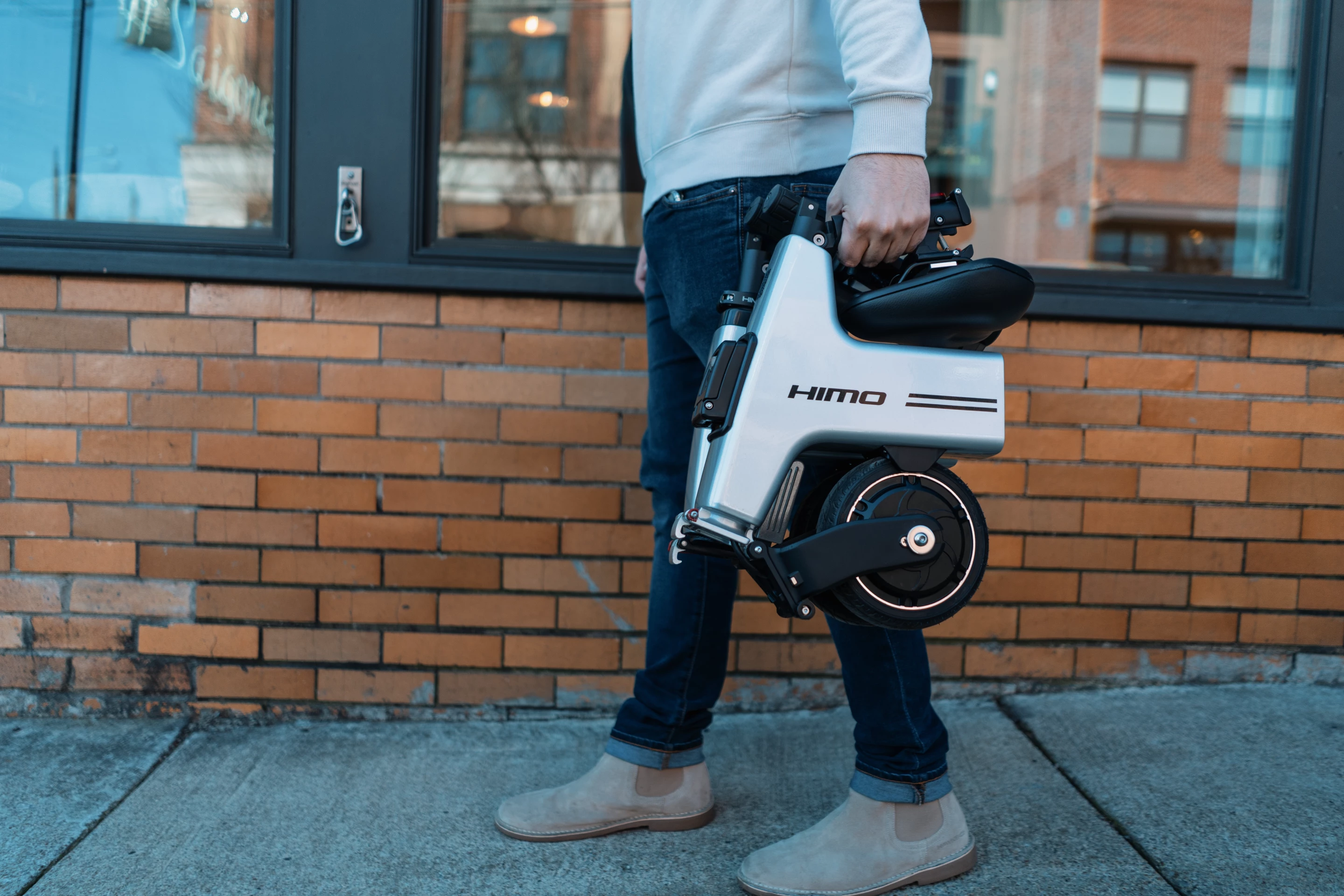 When it's time to go indoors or jump on a train, the HiMo transports easily by hand or backpack