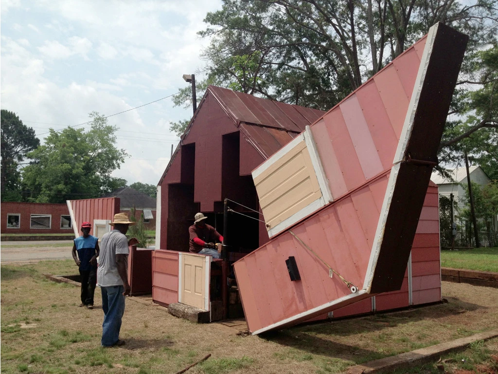 Open House by artist Matthew Mazzotta may look like a simple wooden home, but it actually folds open to create a unique outdoor theater