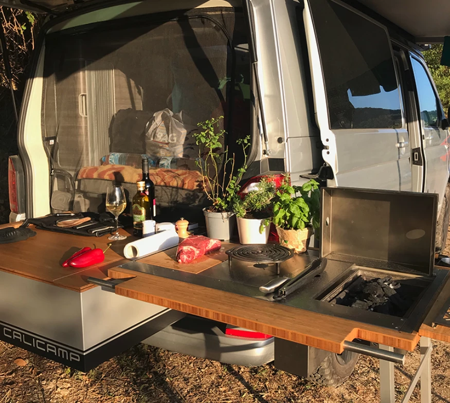 This Calicamp features charcoal BBQ, gas burner and cutting board inserts