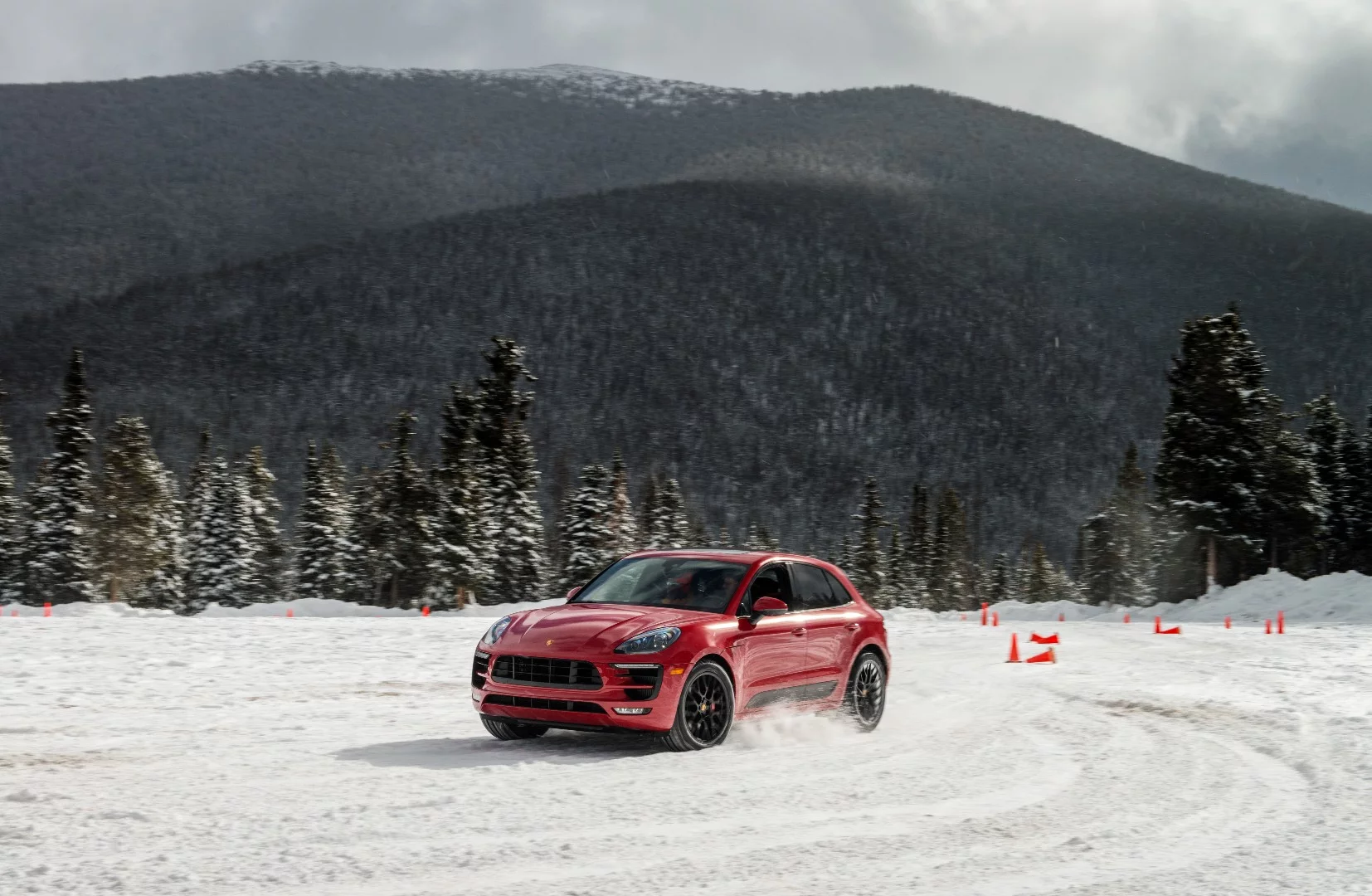 After learning the nuances of the Porsche Macan GTS on ice, we took cues from a professional race driver around the gymkhana course