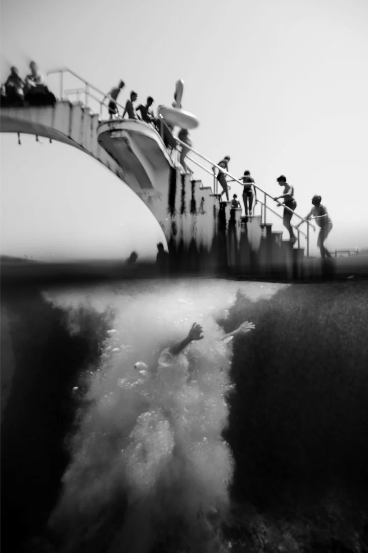 A man enters the water at a beach on Rhodes Island