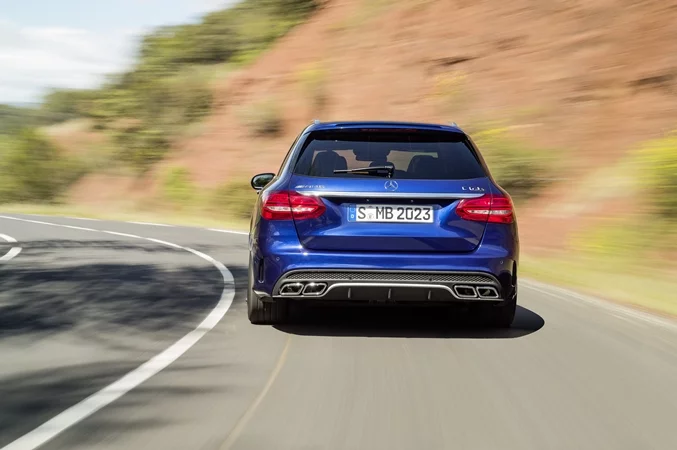 A rear view of the Mercedes-AMG C 63 Estate in motion