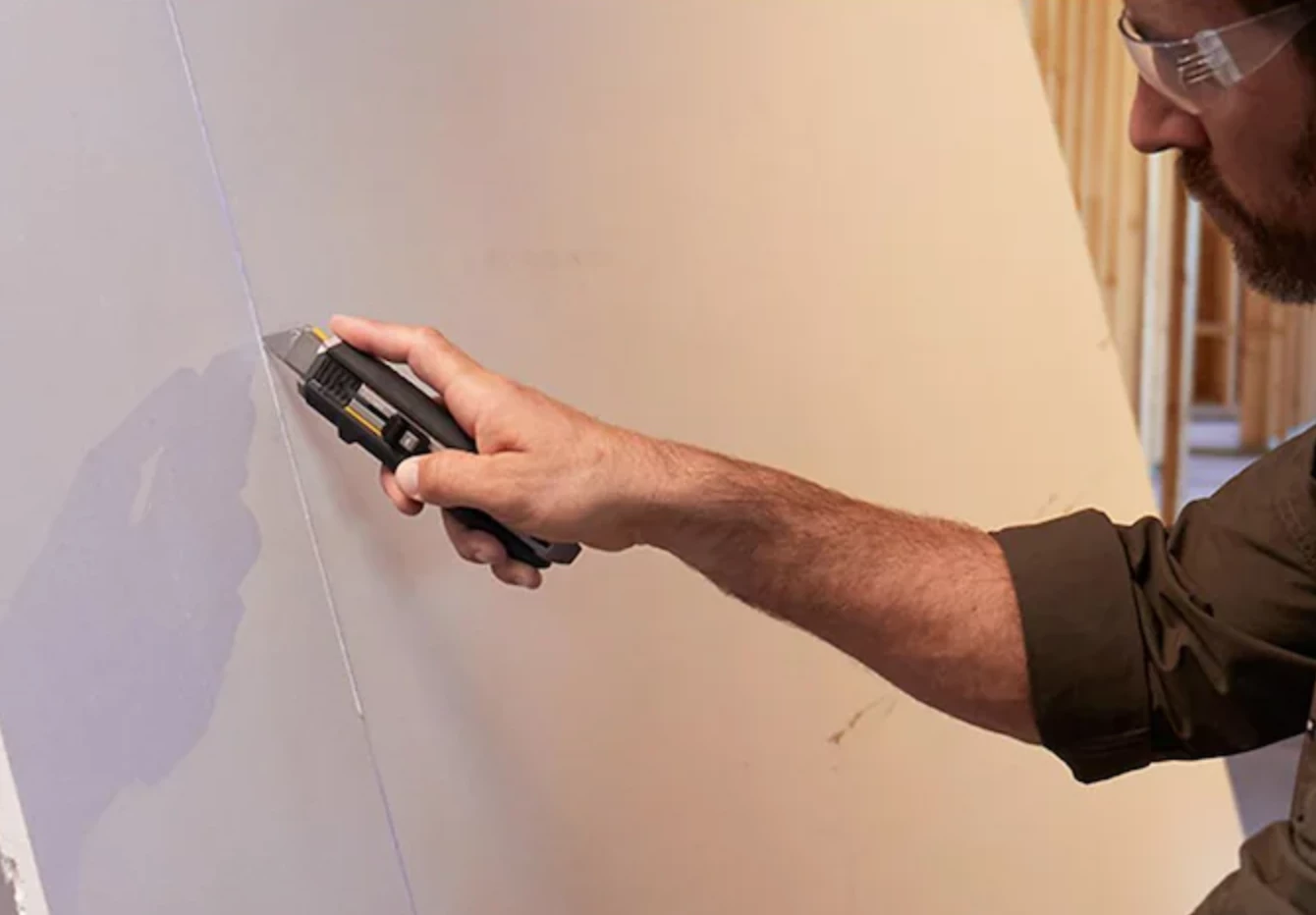 ToughBuilt's Scraper Utility Knife in action as a cutting tool