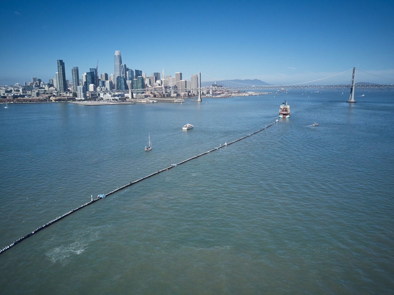 The Ocean Cleanup system is towed out toward the great Pacific Garbage Patch