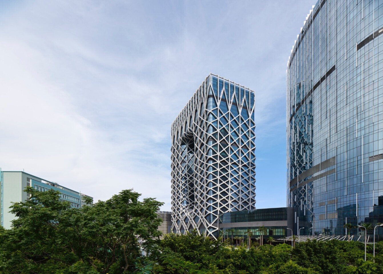 Morpheus Hotel is wrapped in a steel and aluminum exoskeleton that provides structural support