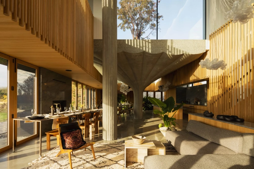 Large windows flood the interior of the home with natural light