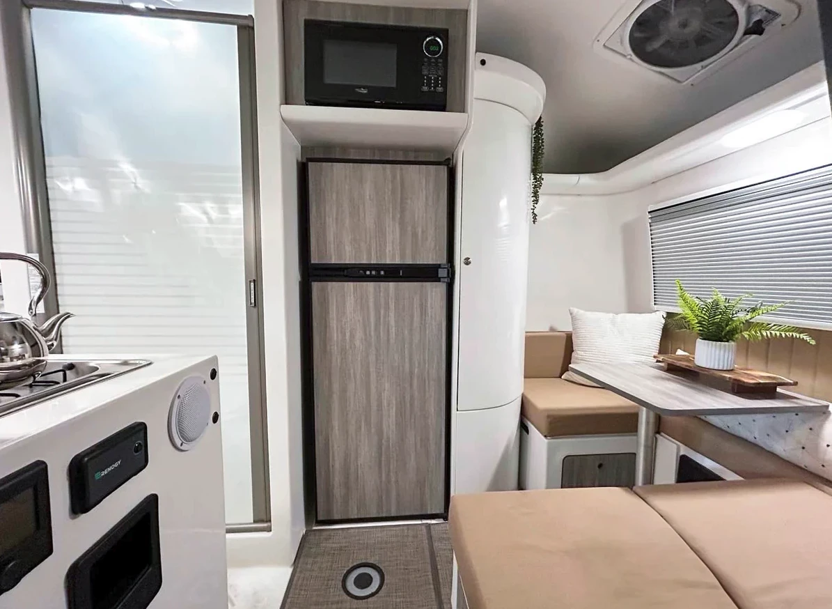 At night, the dinette transforms into a twin bed with optional solo bunk