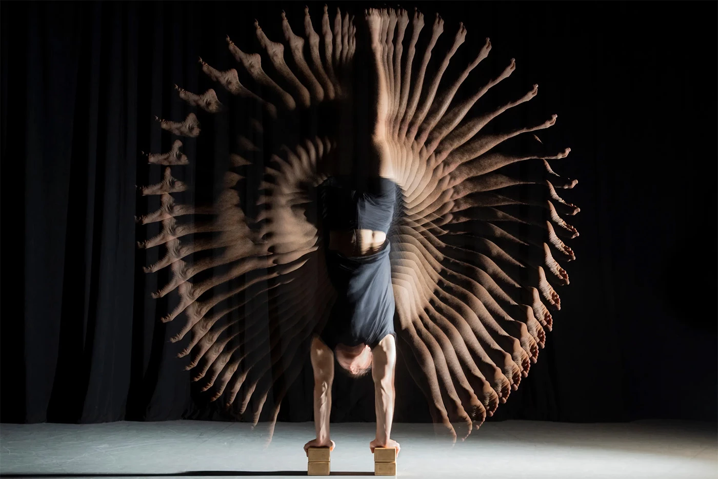 Aerialist Brice Laurent executes a handstand