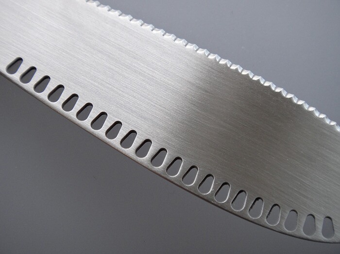 The ButterUp has a row of holes along the non-serrated edge of the knife