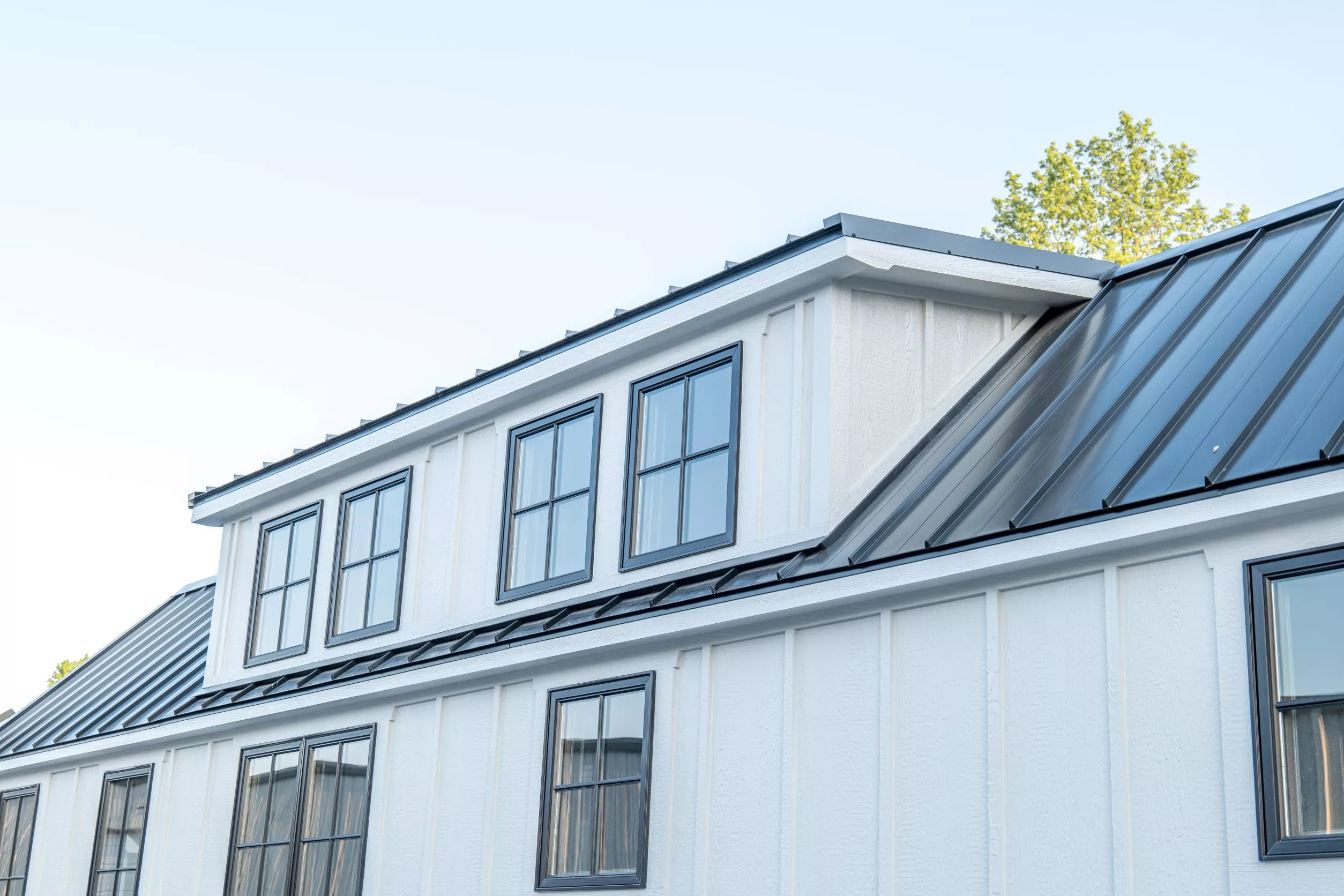 The Teton's exterior consists of board and batten siding, with a seam metal roof