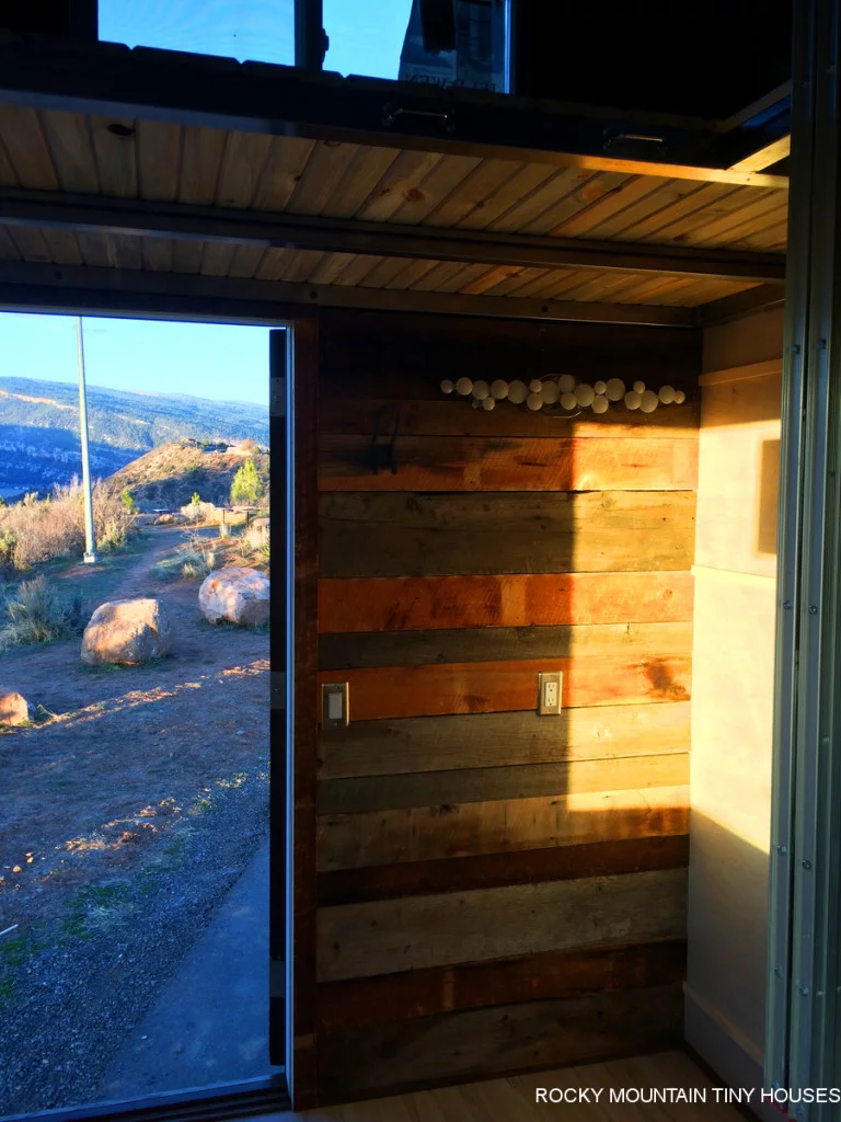 The main floor features a compact sofa bed that serves as the main living and sleeping area