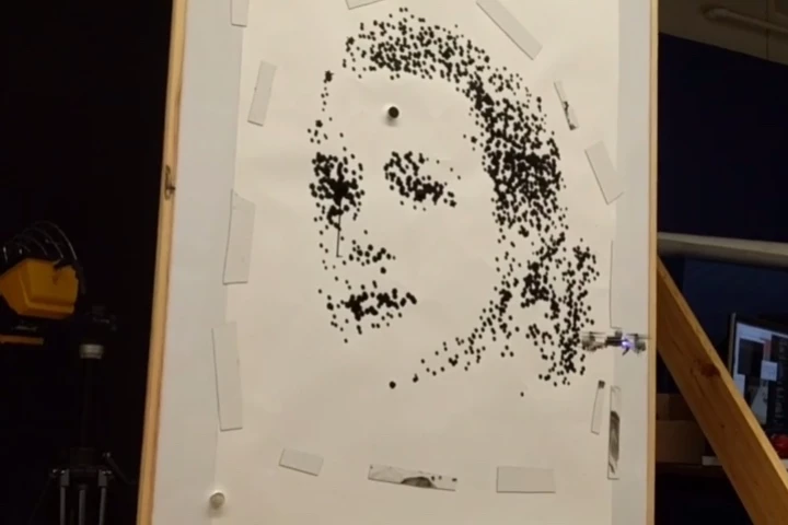 One of the quadcopters works on a portrait of Grace Kelly