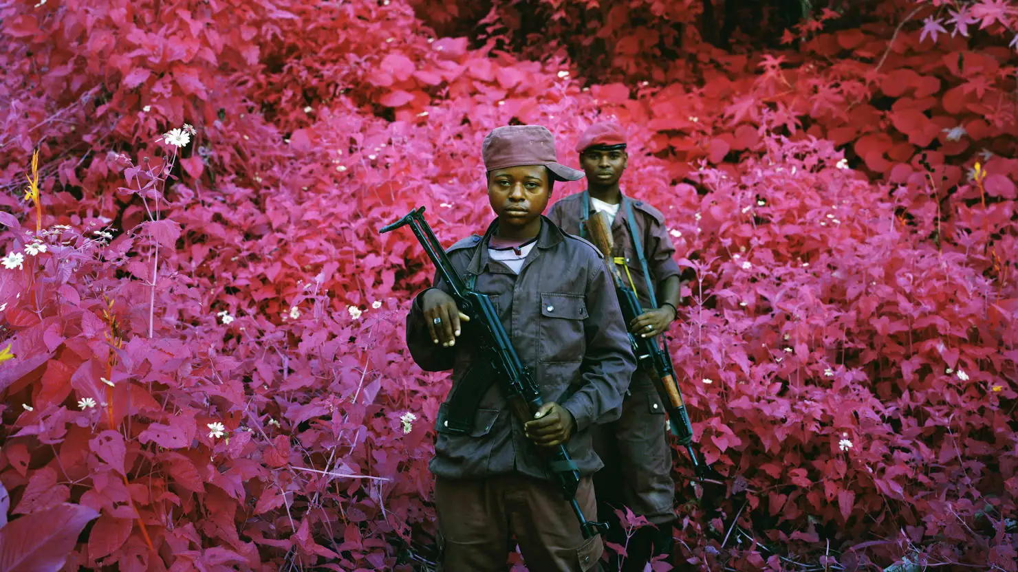 Richard Mosse's amazing series "Infra" depicts rebels in an African civil war using a discontinued military grade infrared film stock that adds surreal pink hues to a landscape devastated by violent conflict