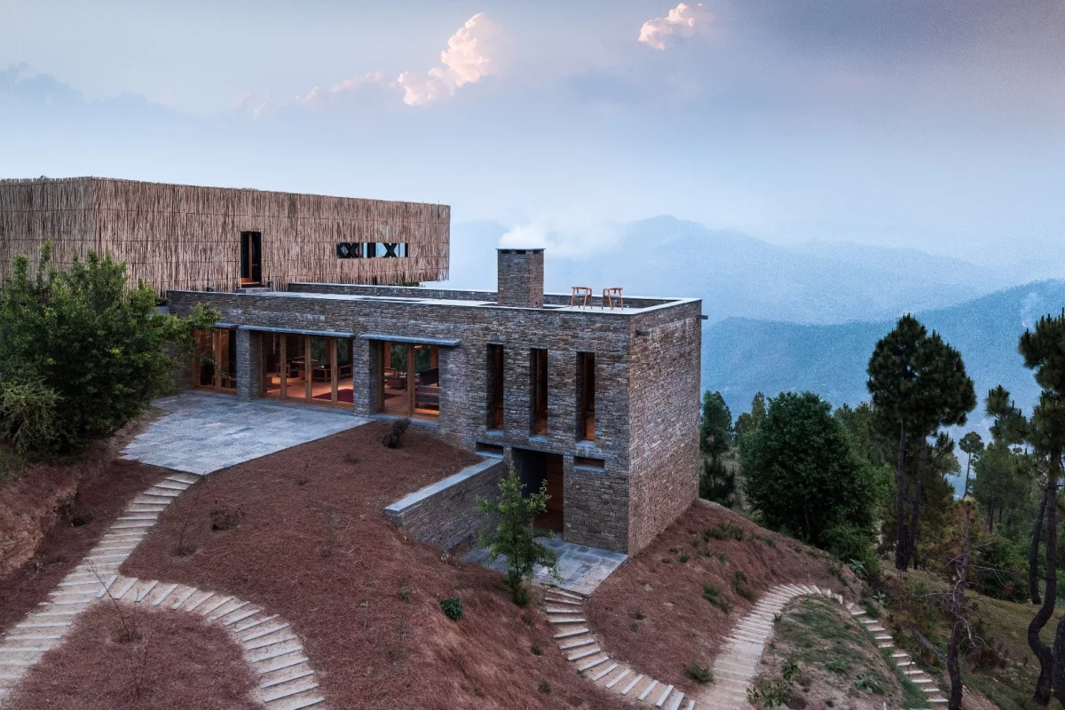 The Kumaon Hotel features a cantilevered dining room that juts out over the valley below