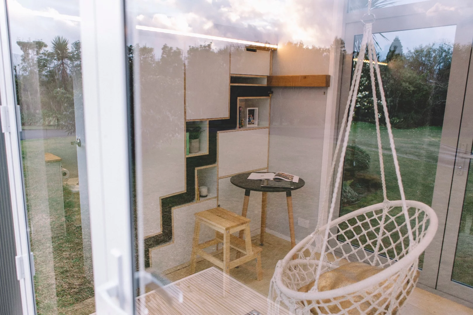 The Millennial Tiny House's novel underfloor storage means that you can't put a couch and table on there without losing easy access