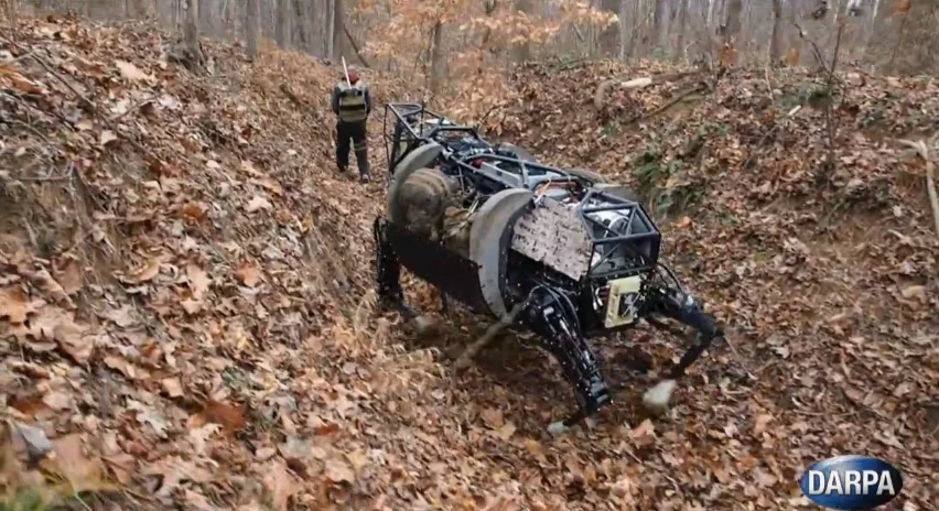 The LS3 follows a soldier through the woods during a training exercise