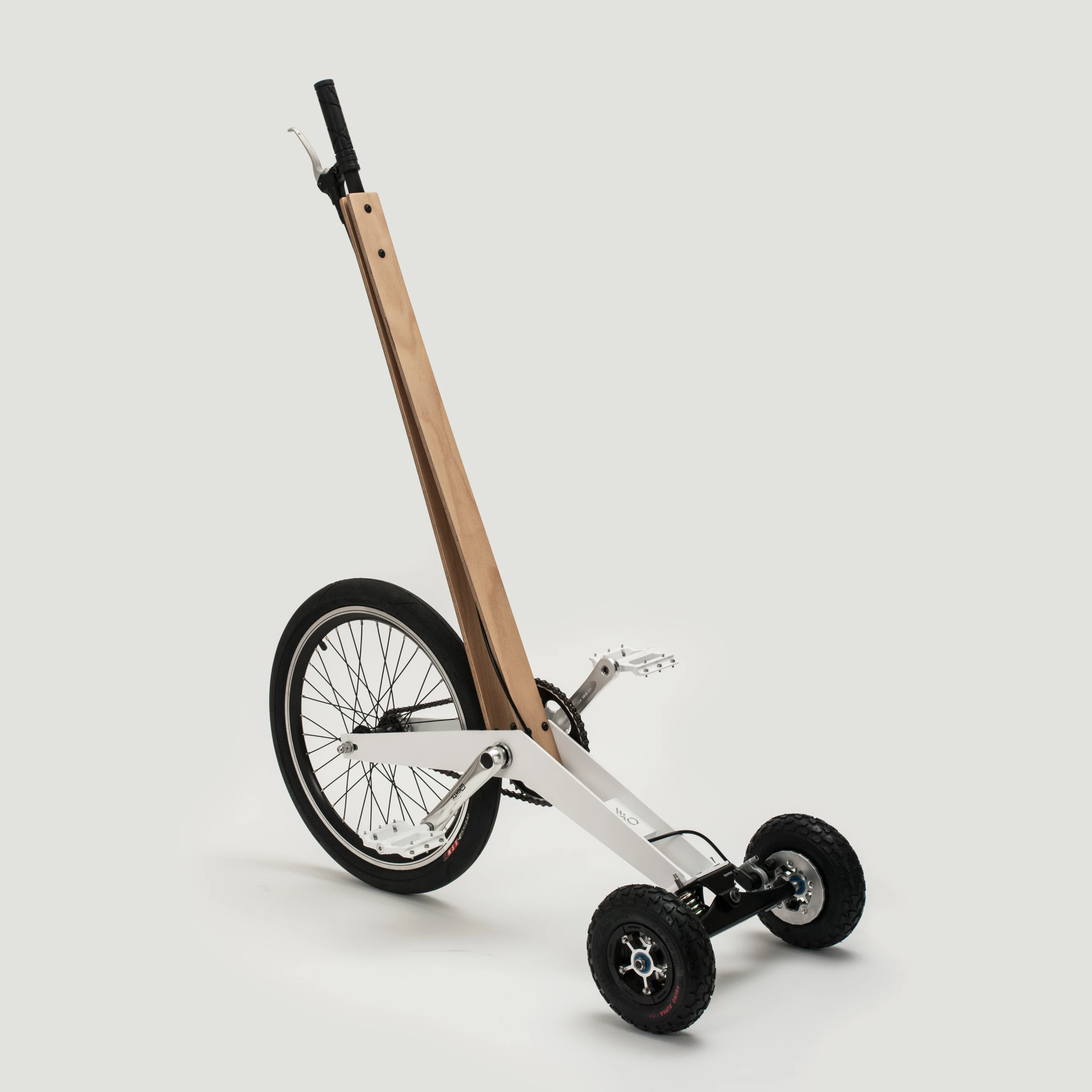 The Halfbike is steered by a combination of the vertical laminated plywood pole and the rider's lean