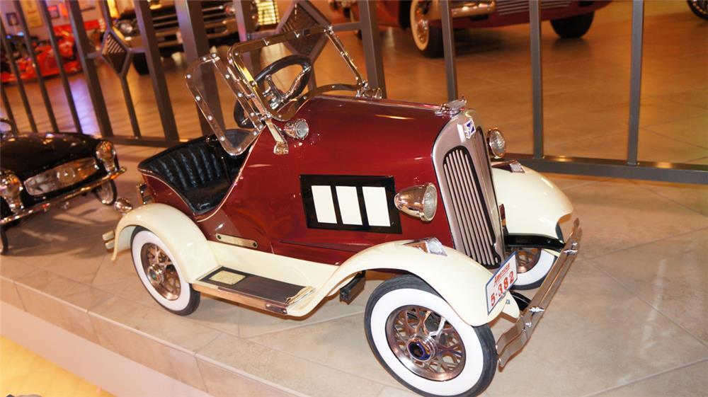 This 1933 Buick pedal car by American National was restored by McLaren Classic Restorations and sold for $19,550 as part of the Pratte Collection. The Buick has leaf spring suspension, nine working lights, genuine ostrich skin tufted upholstered seat and engraved silver step pad.