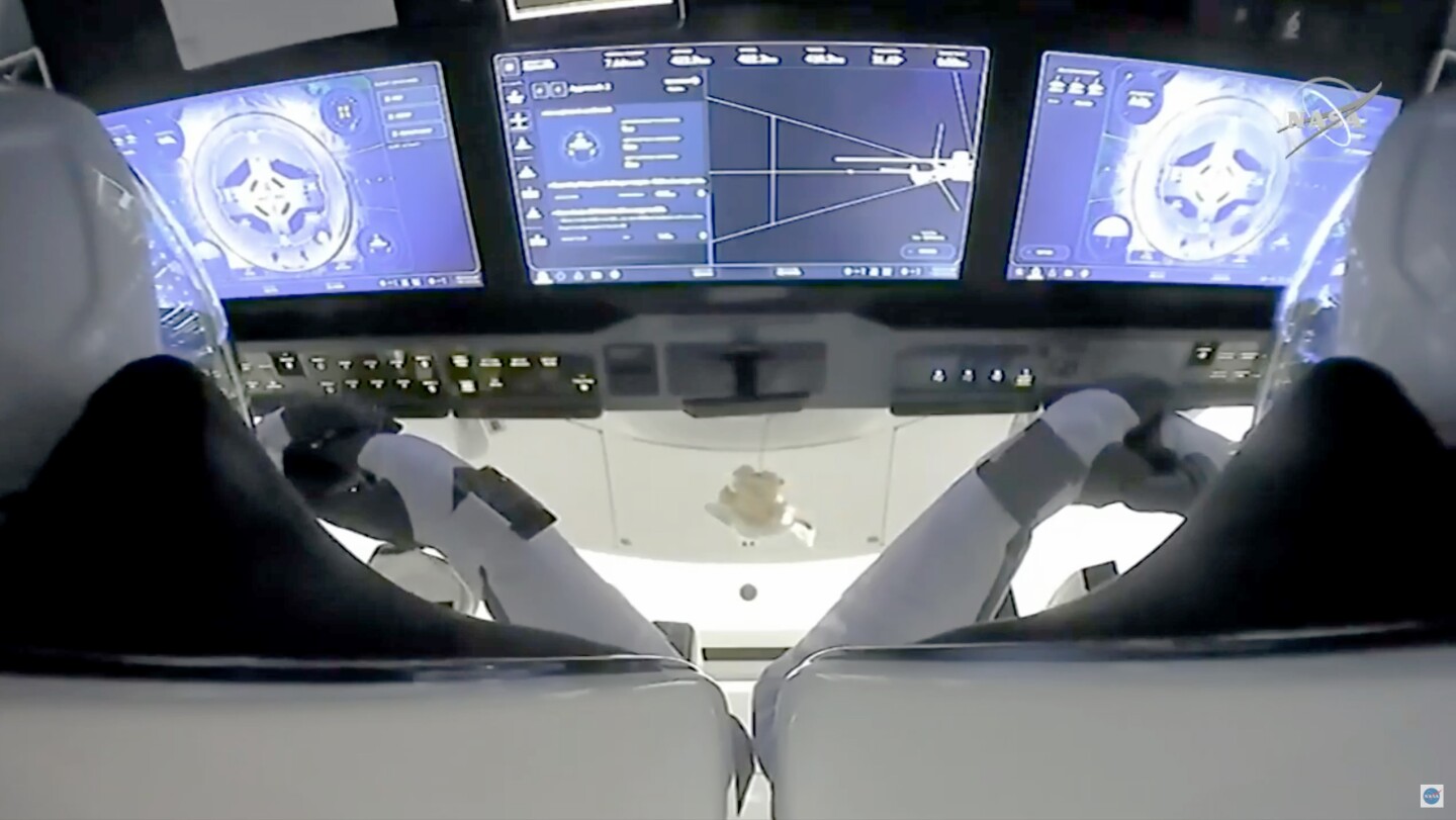 View from inside the Crew Dragon capsule as the astronauts prepare to dock with the ISS