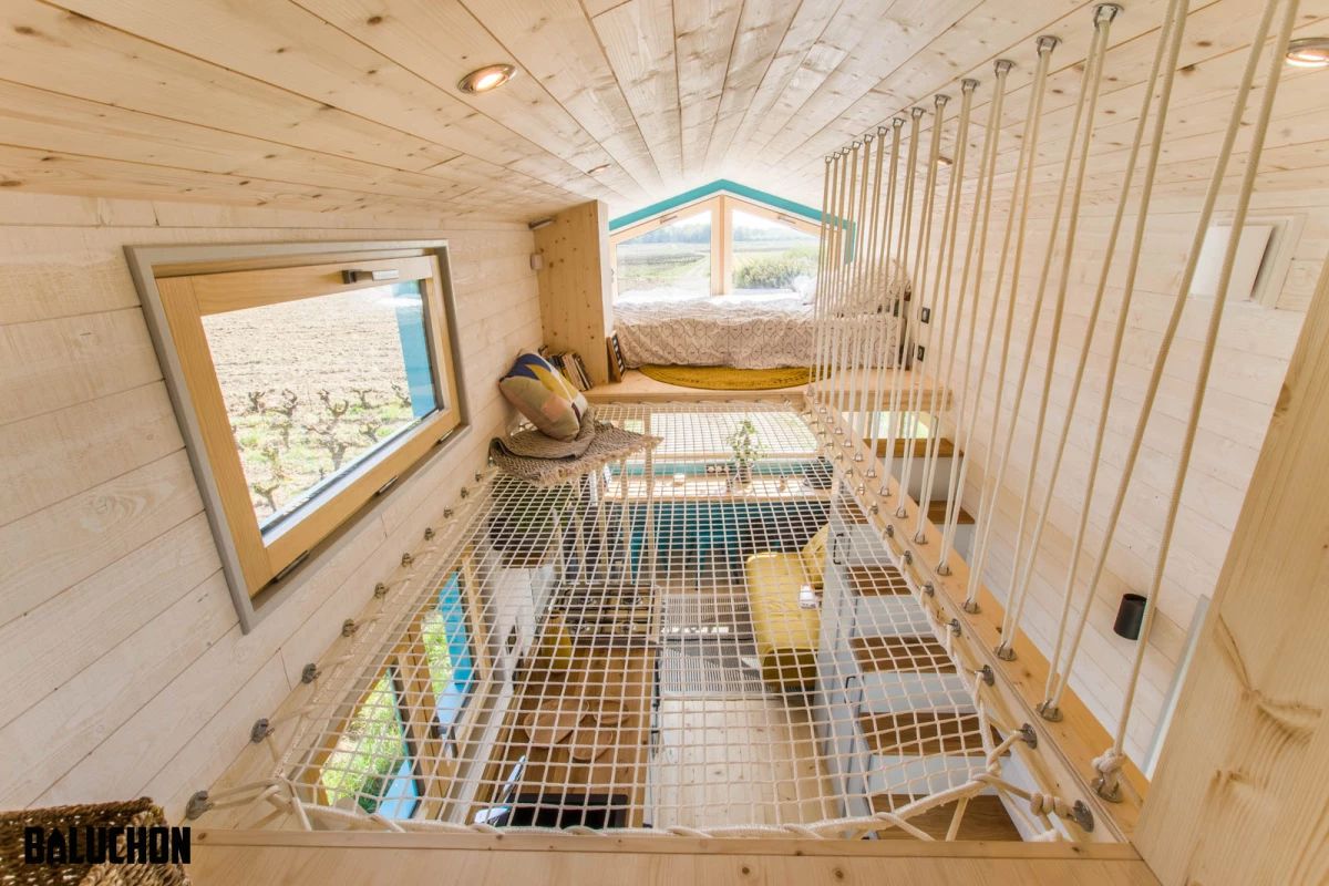Tiny House Sïana's secondary bedroom is accessed from the main bedroom by using the net