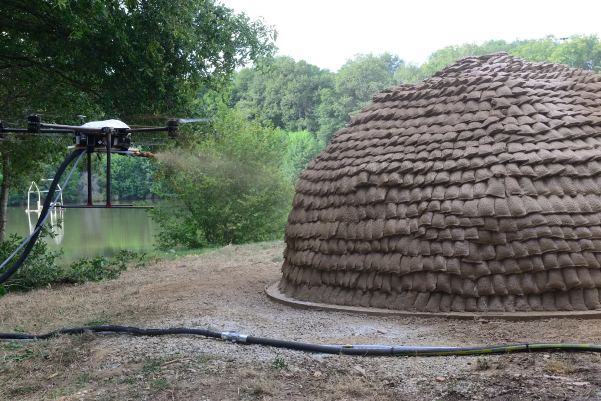 Researchers hope to fit drones with spraying hoses to apply layers of biomaterials onto light structures, such as geodesic dome frames or grid shells covered in tensile fabrics