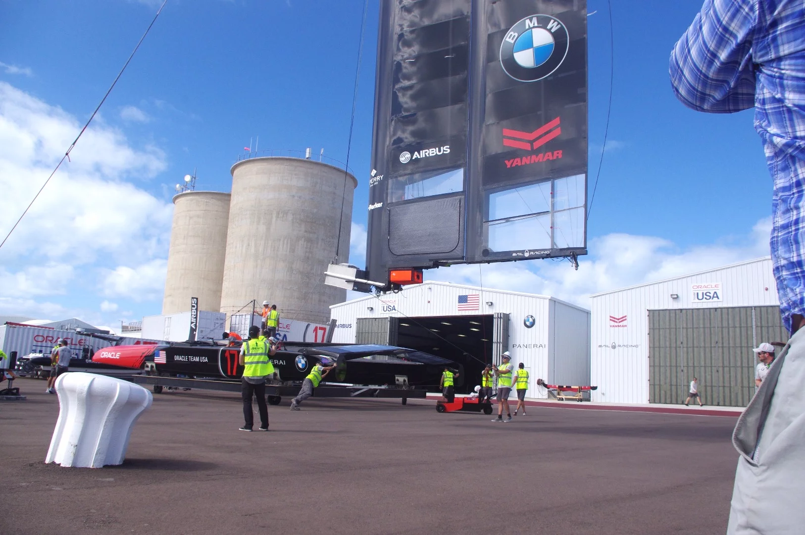The wing being hoisted into place on the yacht