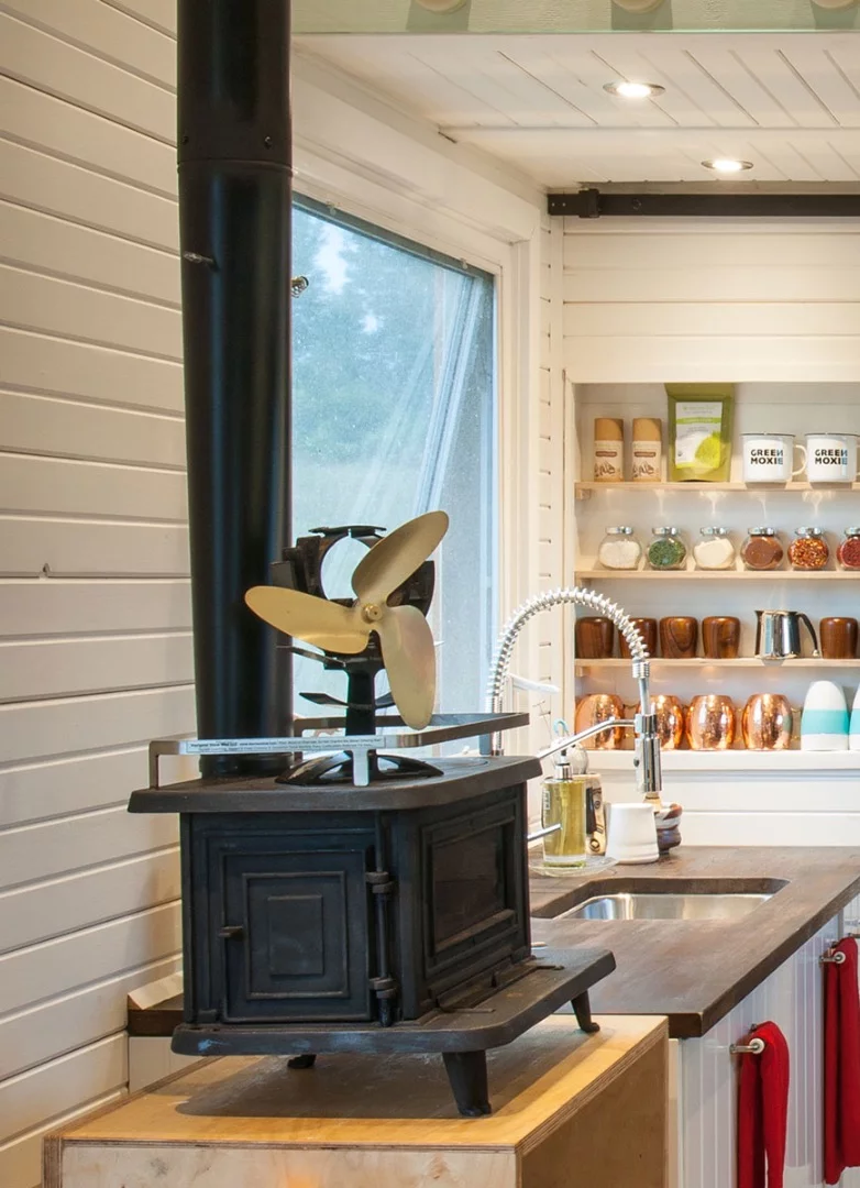Heating for the Greenmoxie Tiny House comes from both a small wood-burning stove and a propane heater