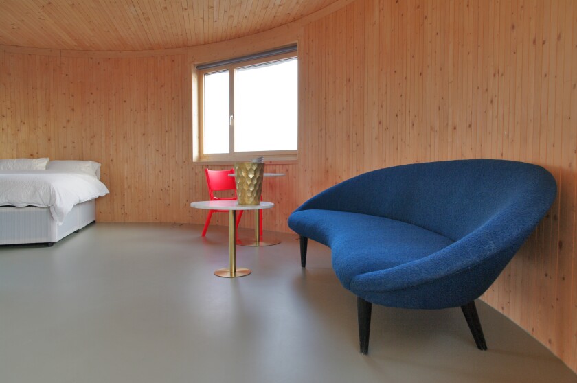 The 7-meter (23-ft) diameter cylinder accommodates a living room, kitchen and bathroom on the first floor, two bedrooms and a bathroom on the second floor, and a large living area on the third