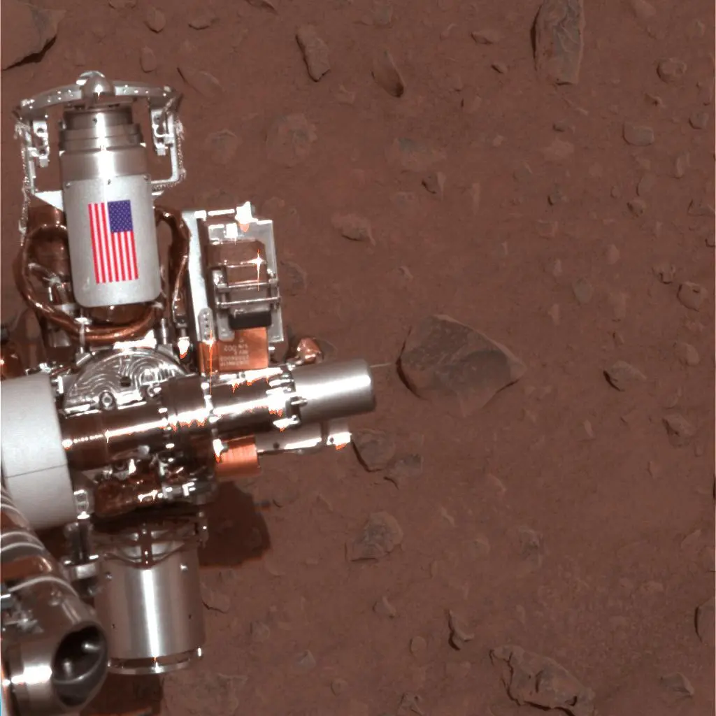 This piece of metal with the American flag on it on Opportunity's sister rover, Spirit (MER-A), is made of aluminum recovered from the site of the World Trade Center towers