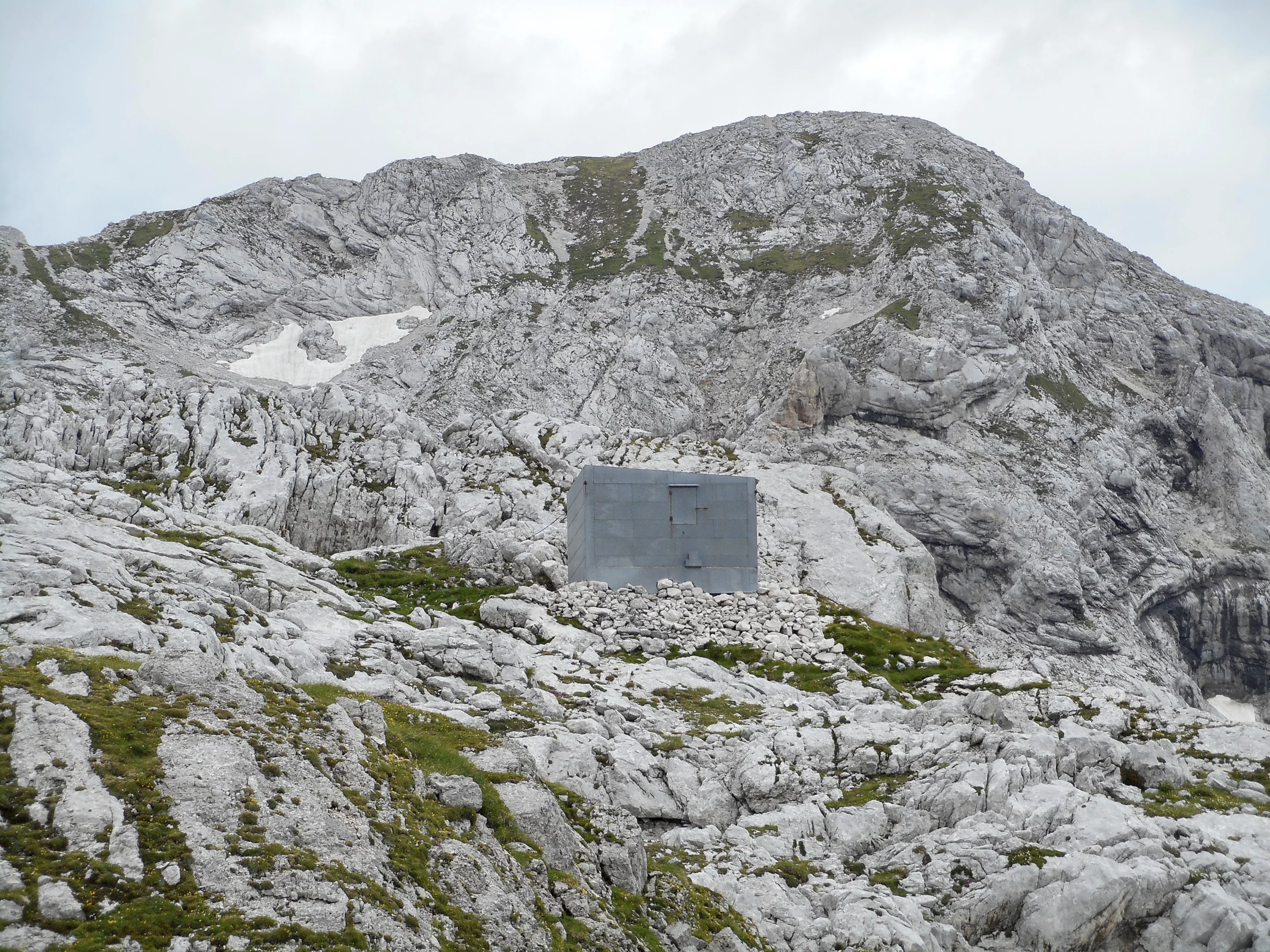 The old cabin has now been replaced with the new shelter by Slovenian architectural firm OFIS