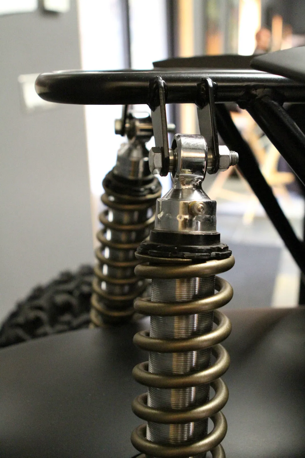 4-link rear suspension with coil-overs are attached to a mounting point high above the rear wheels