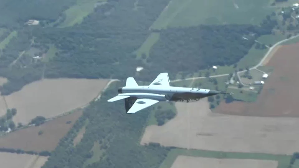 A Boeing T-7A Red Hawk Trainer flying inverted