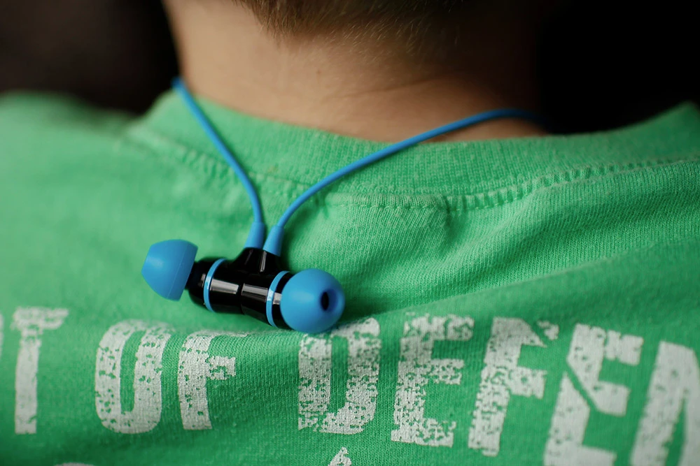 The two ear buds are designed to snap together, so they can be worn around the neck when not in use