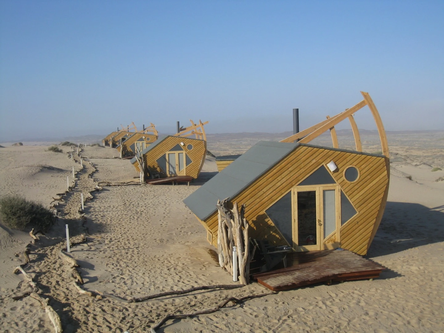 Inside the cabins at Namibia's Shipwreck Lodge, guests find a wood burner stove and an ensuite