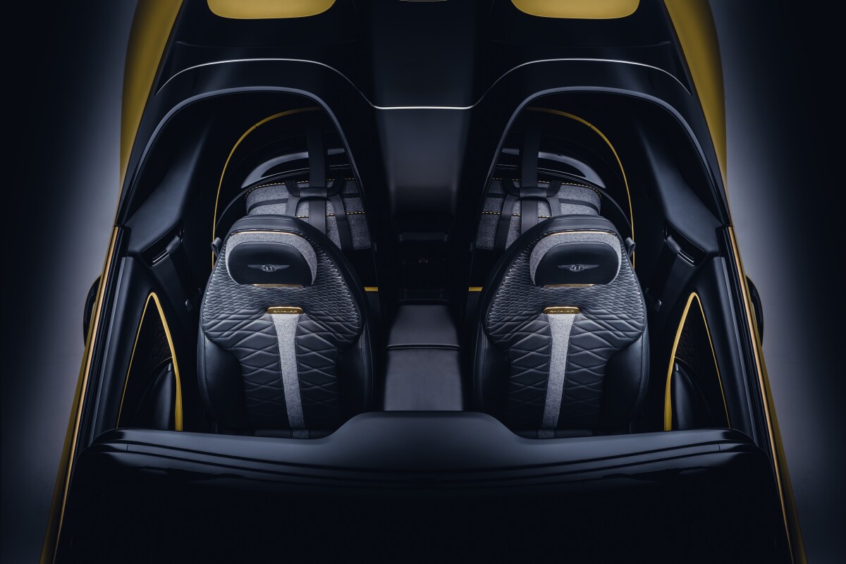 The rear seats of the Continental GT platform are replaced by compartments designed around bespoke Italian luggage