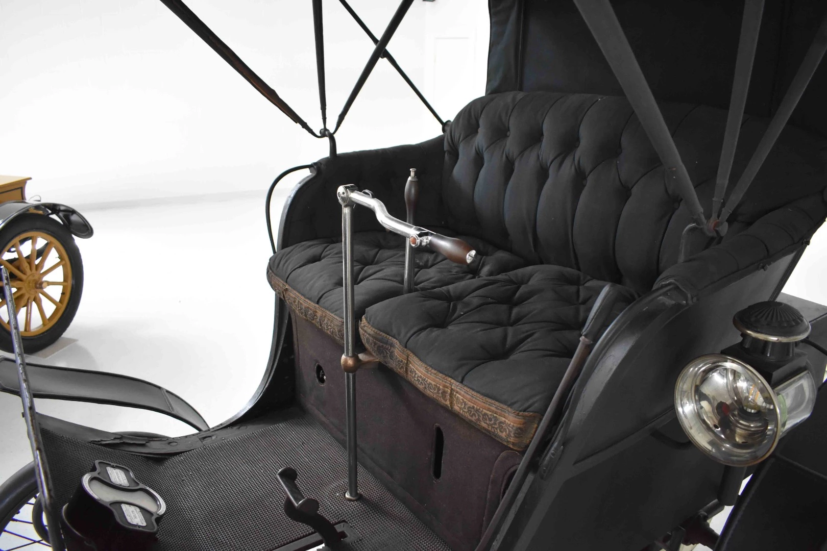 Astonishing condition for its age – the 1898 Riker Electic. Steering was via the tiller bar